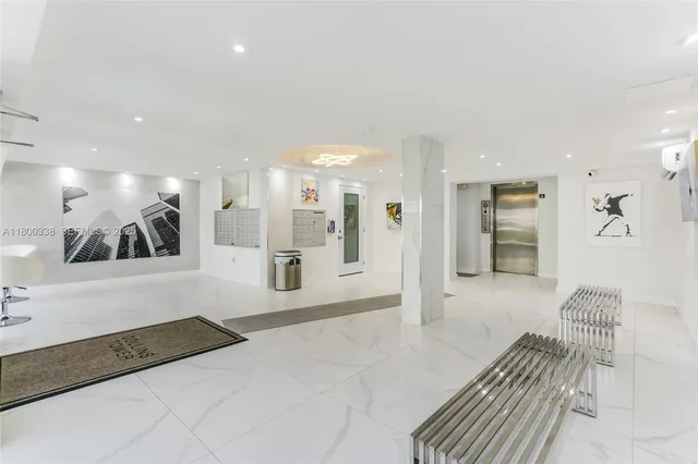 a spacious bathroom with a large mirror vanity and shower