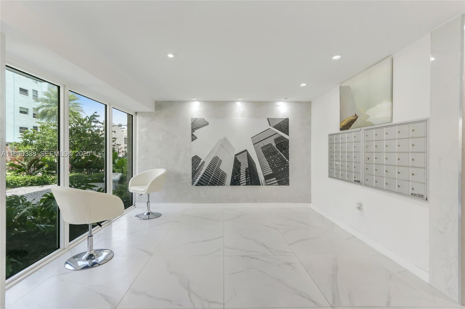 720 Collins Avenue, Unit PH1 Miami Beach, FL 33139 - Photo 22 of 27 a living room with furniture and a large window