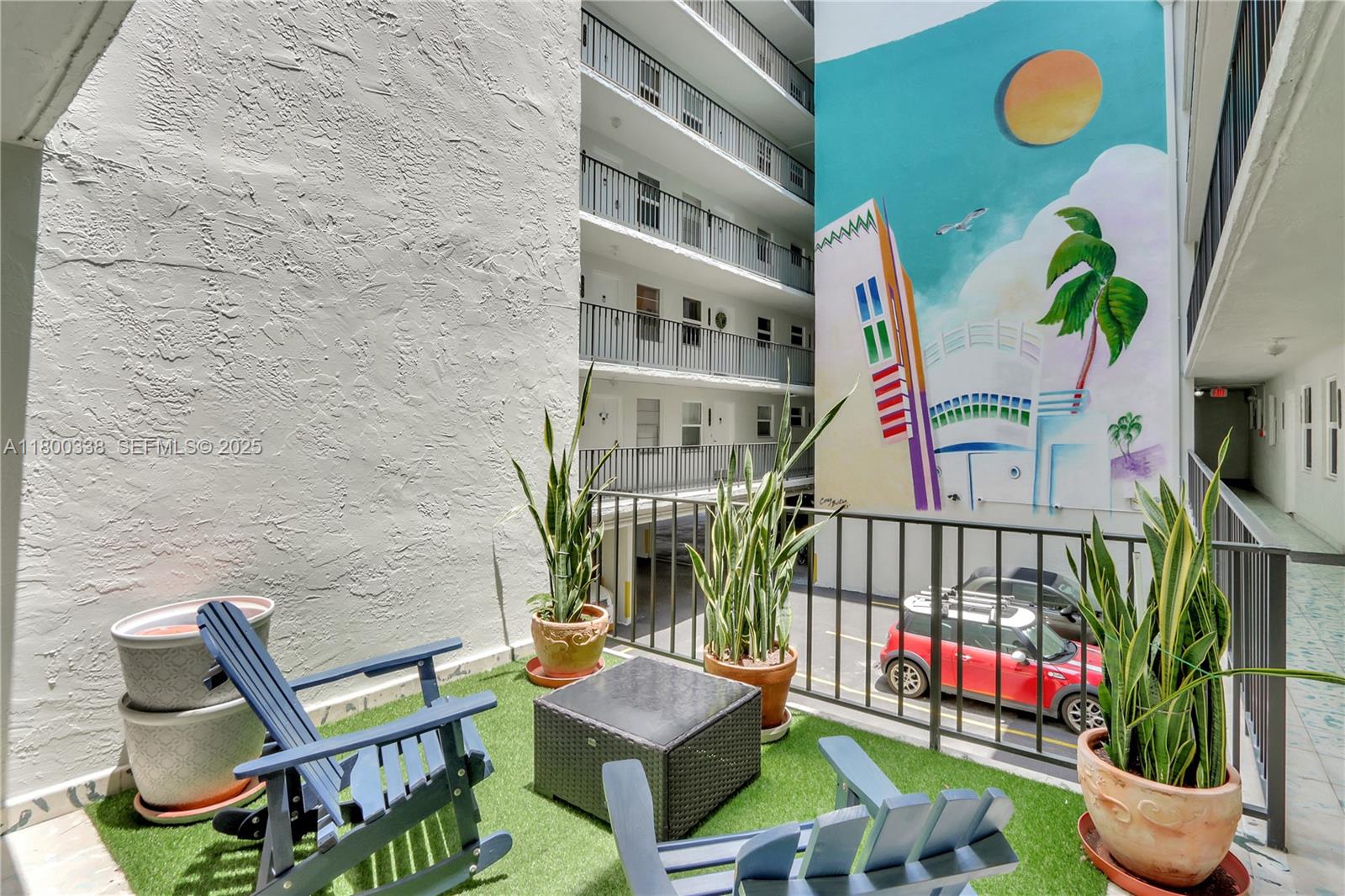 720 Collins Avenue, Unit PH1 Miami Beach, FL 33139 - Photo 23 of 27 a front view of a house with outdoor seating