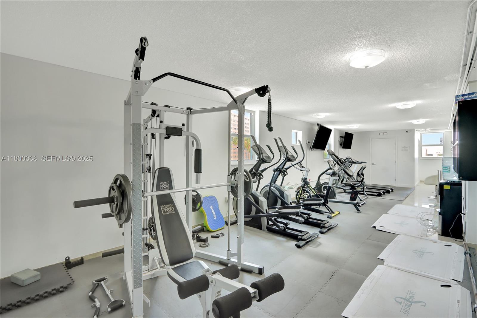 720 Collins Avenue, Unit PH1 Miami Beach, FL 33139 - Photo 24 of 27 a view of a room with gym equipment