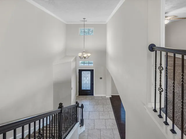 a view of a hallway with front door