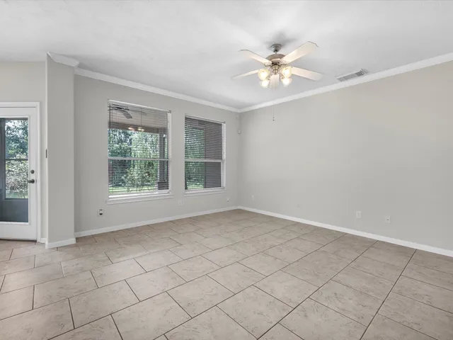 a view of an empty room with a window