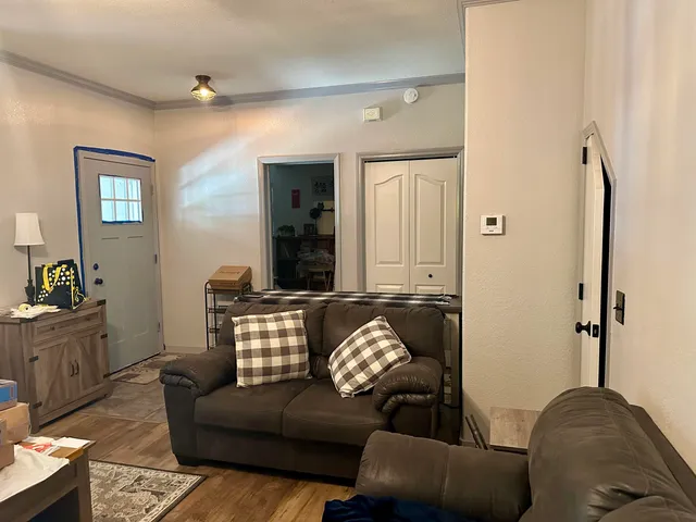 a living room with furniture and a window