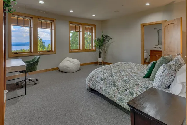 a bedroom with furniture and a window