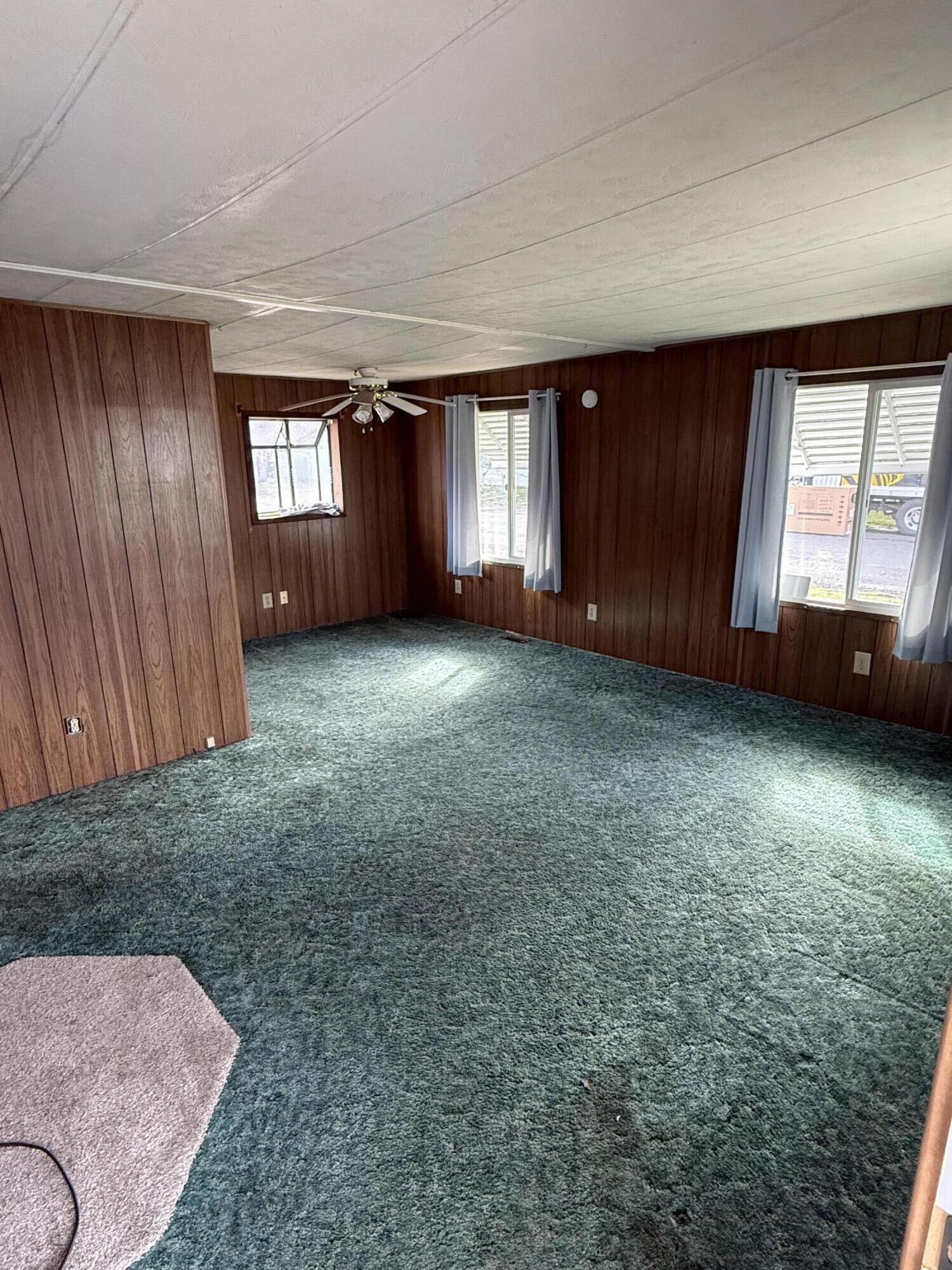 421 Stevens Road, Unit 20 Eagle Point, OR 97524 - Photo 5 of 22 an empty room with windows
