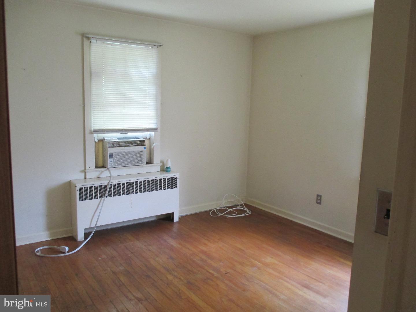 97 Schoolhouse Road Carneys Point, NJ 08069 - Photo 12 of 25 a view of a room with wooden floor and windows