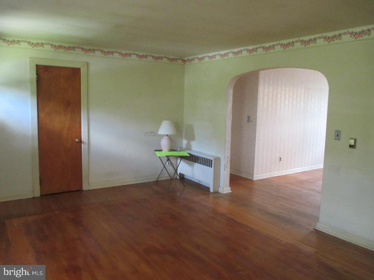 97 Schoolhouse Road Carneys Point, NJ 08069 - Photo 5 of 25 a view of a room with wooden floor and bathroom