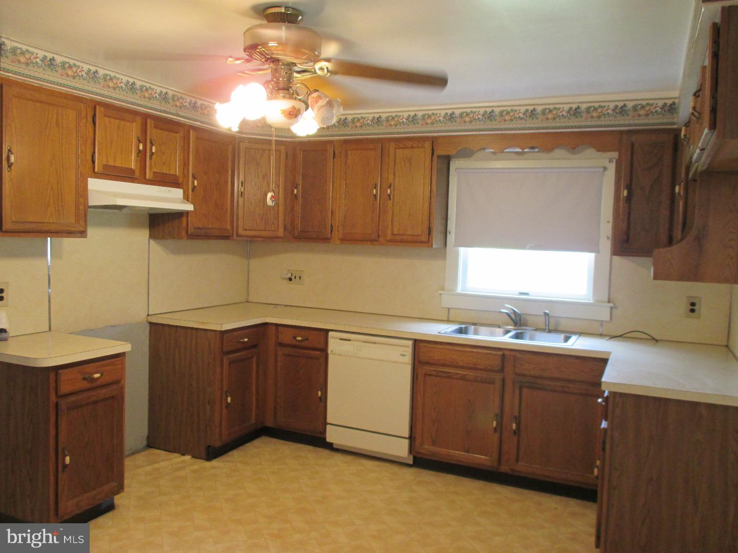 97 Schoolhouse Road Carneys Point, NJ 08069 - Photo 7 of 25 a kitchen with a sink and cabinets