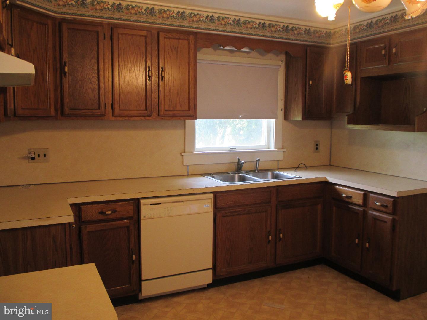 97 Schoolhouse Road Carneys Point, NJ 08069 - Photo 8 of 25 a kitchen with sink and cabinets