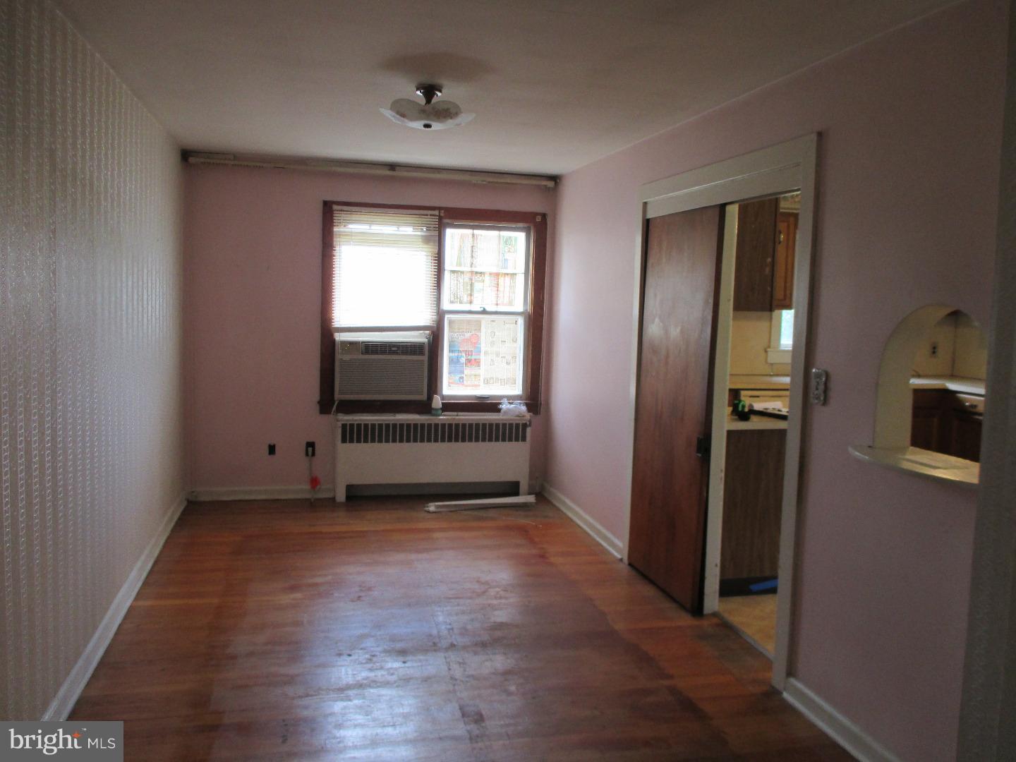 97 Schoolhouse Road Carneys Point, NJ 08069 - Photo 9 of 25 a view of a kitchen with refrigerator and wooden floor