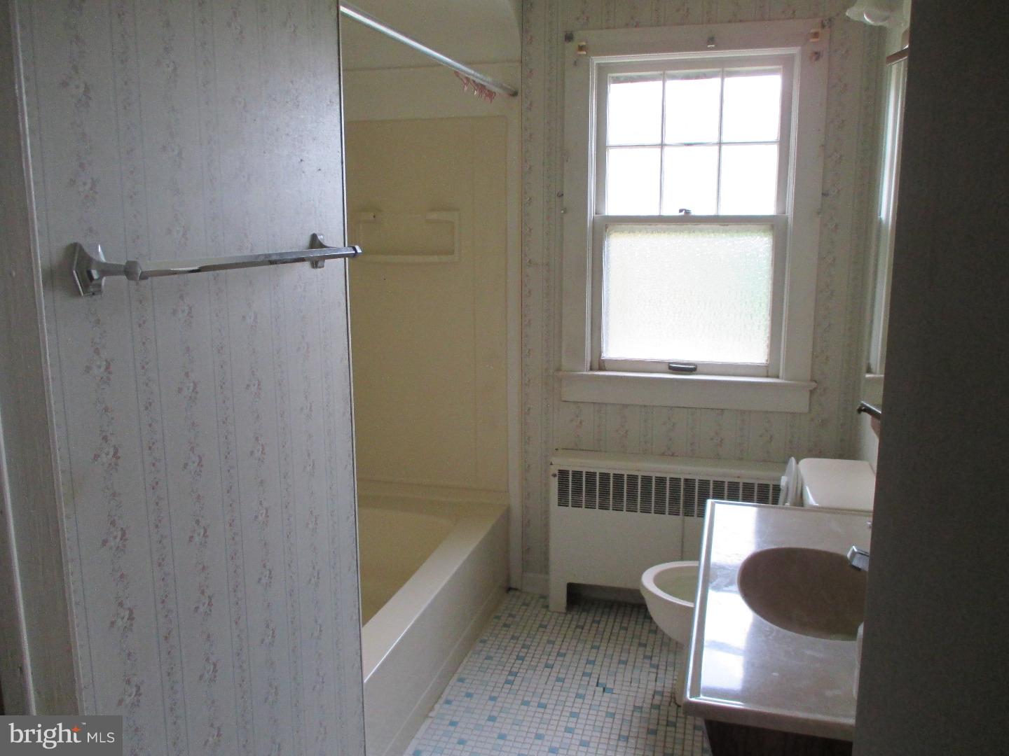 97 Schoolhouse Road Carneys Point, NJ 08069 - Photo 10 of 25 a bathroom with a tub and a window