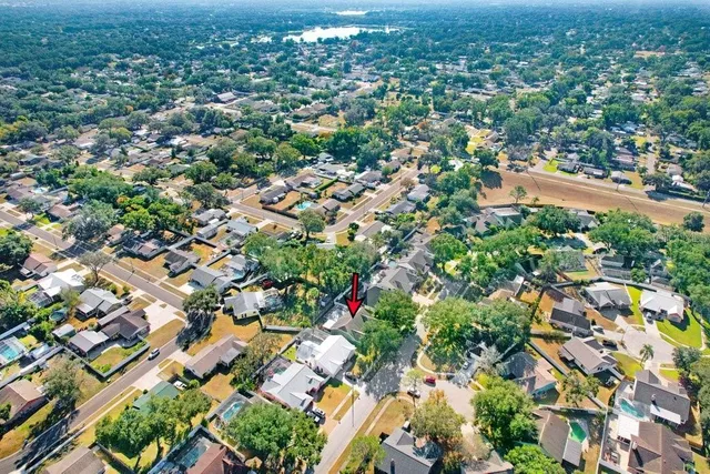 an aerial view of residential houses with city view
