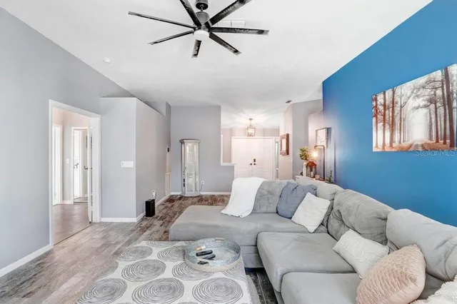 a bedroom with a bed couch and window