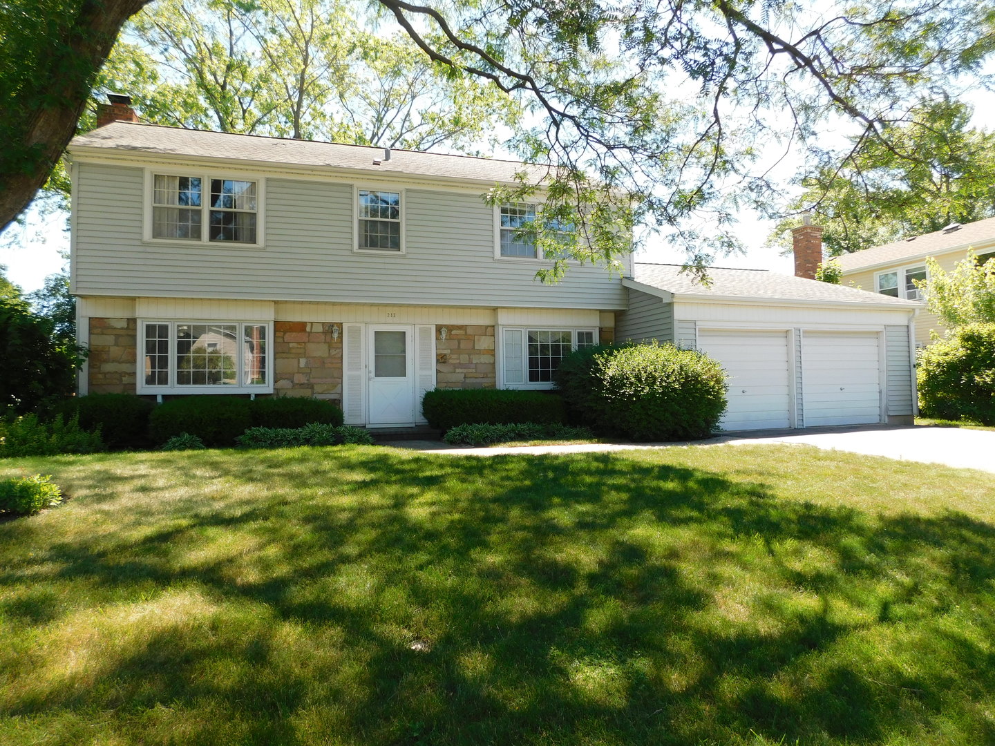 213 Weidner Road Buffalo Grove, IL 60089 - Photo 1 of 15 a front view of a house with a yard