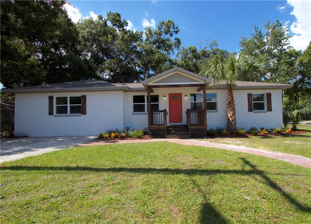 3402 North Tampania Avenue Tampa, FL 33607 - Photo 1 of 1 a front view of a house with a yard
