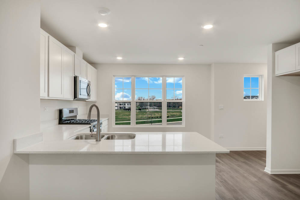340 Basin Ct Street St. Charles, IL 60174 - Photo 12 of 29 a kitchen with a sink and a large window