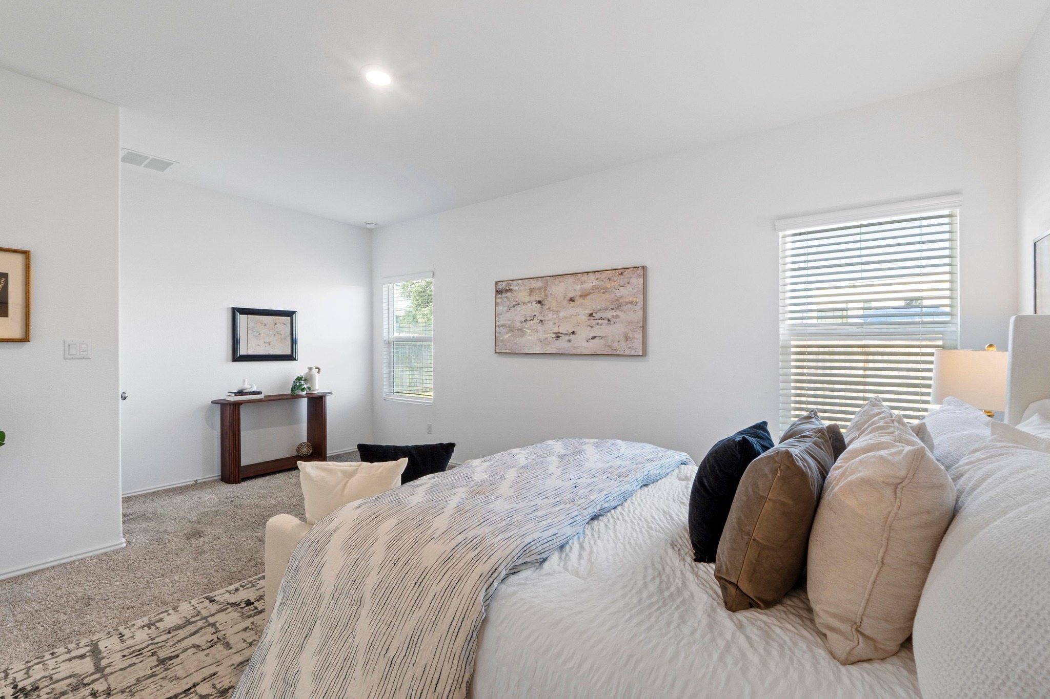 1705 Woolsey Way Leander, TX 78641 - Photo 20 of 35 a bedroom with a bed and a lamp