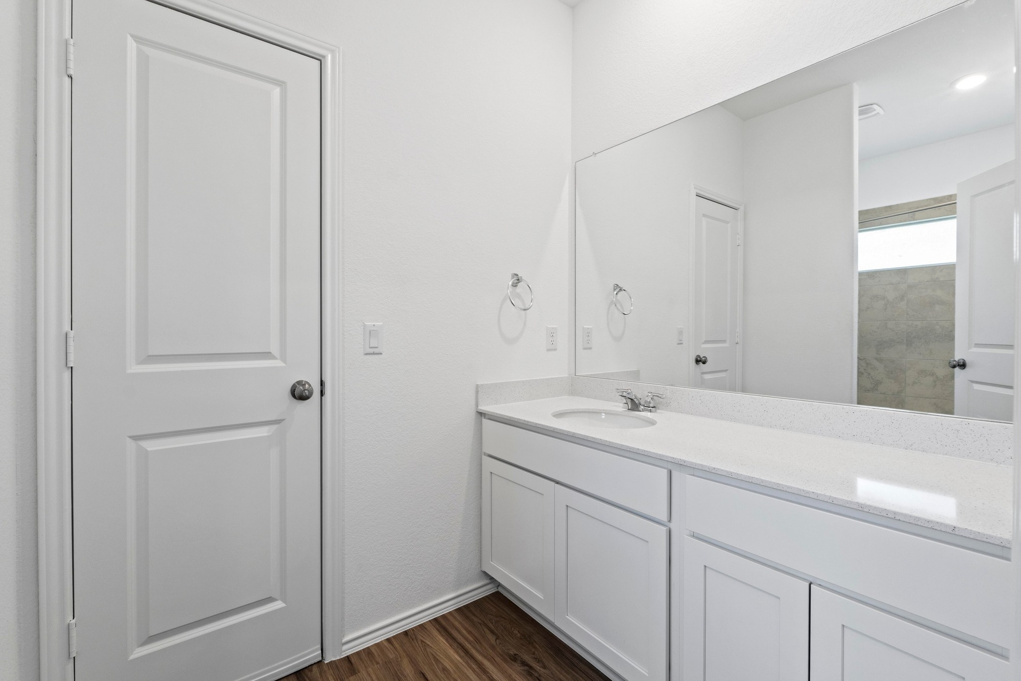 1705 Woolsey Way Leander, TX 78641 - Photo 28 of 35 a bathroom with a sink and a mirror