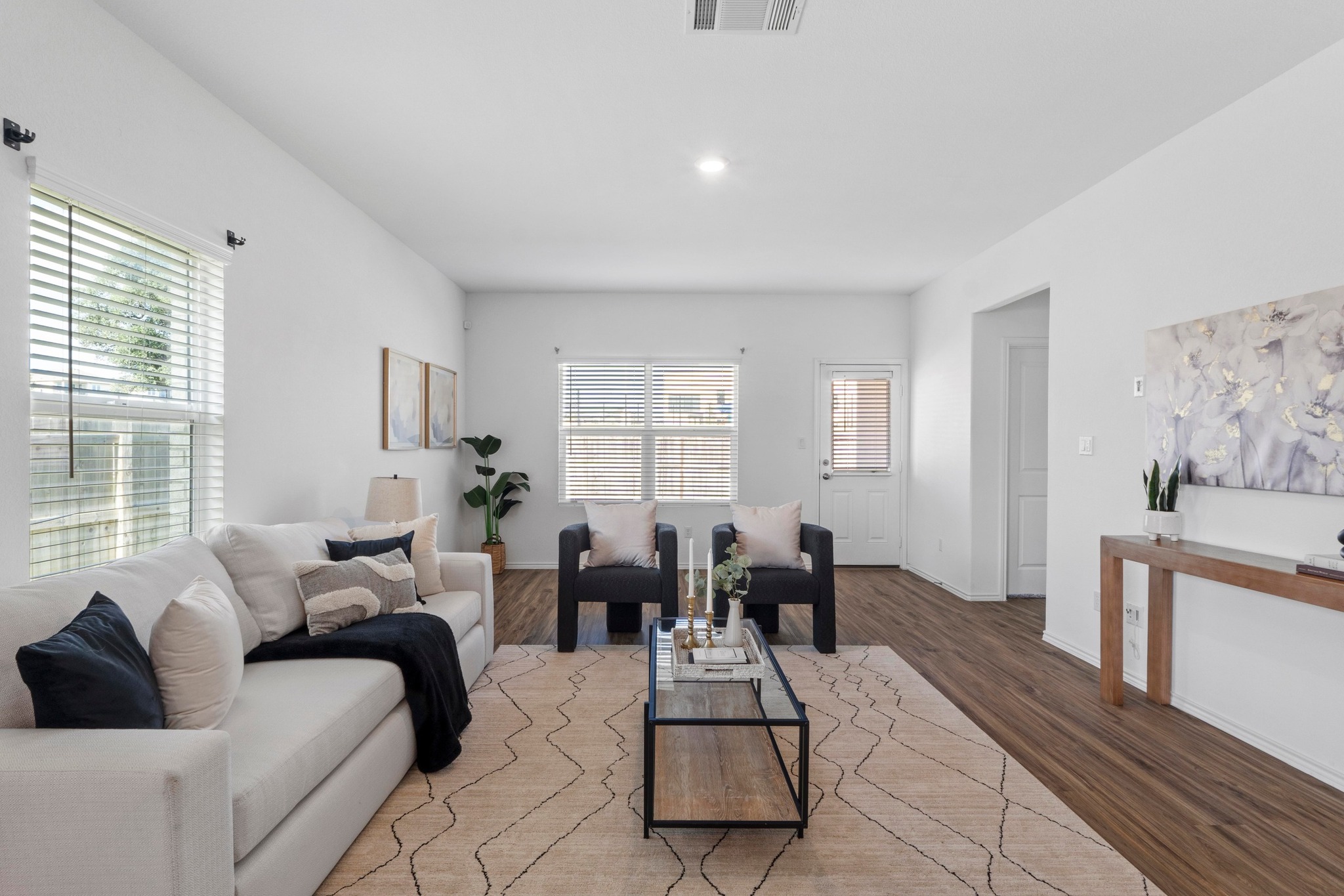 1705 Woolsey Way Leander, TX 78641 - Photo 9 of 35 a living room with furniture dining area and windows