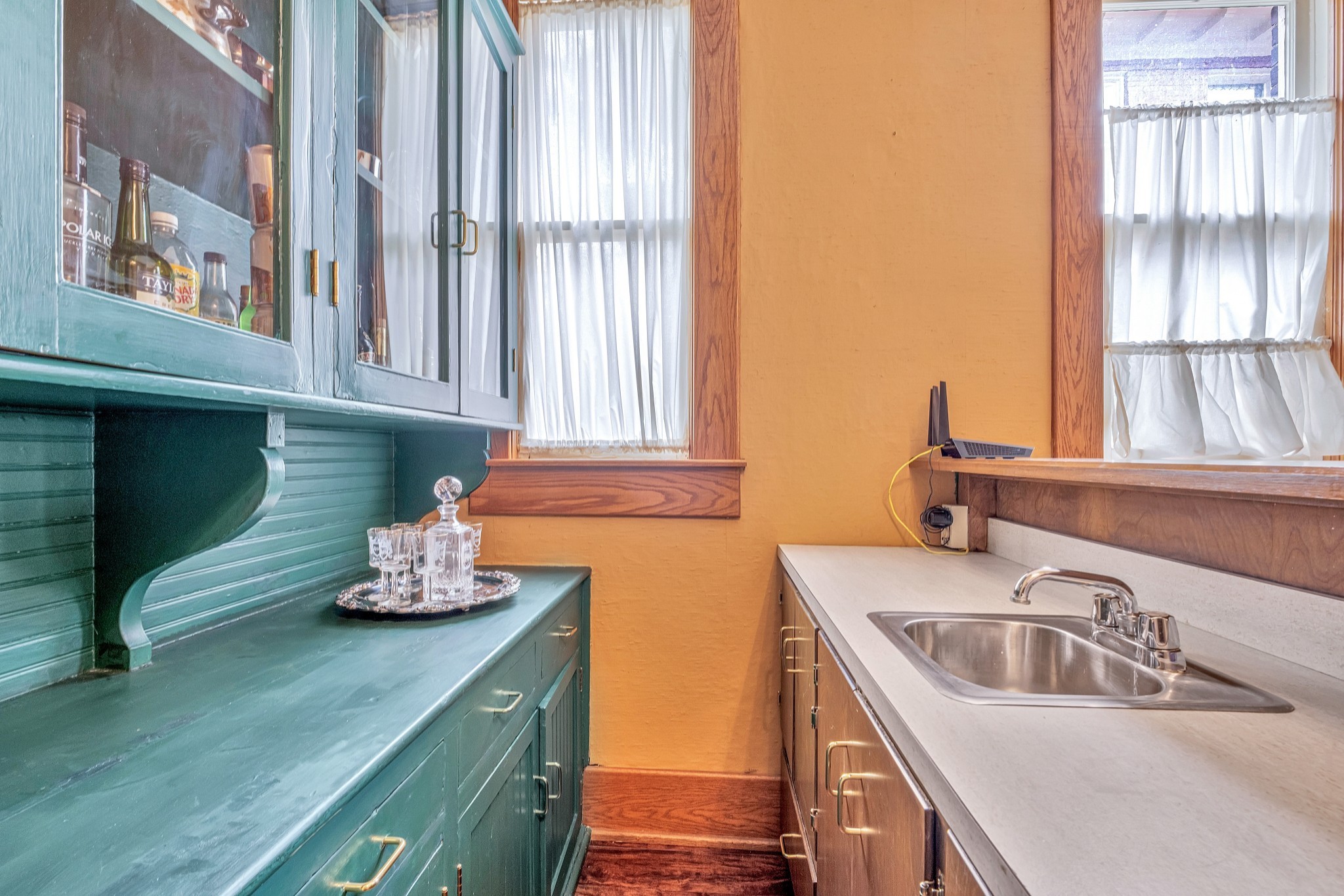 908 West Main Street Franklin, TN 37064 - Photo 19 of 55 a kitchen with a sink a counter and cabinets