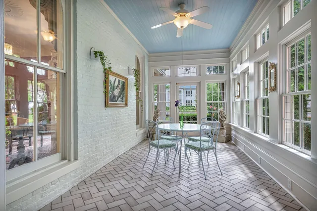 a kitchen with stainless steel appliances granite countertop a sink a counter space and a window