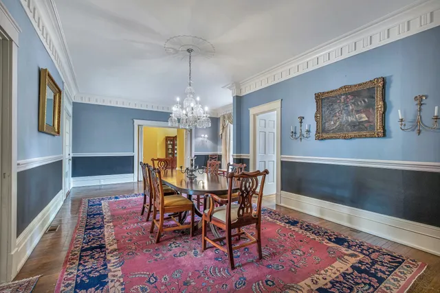 a front view of a house with wooden floor and a front door