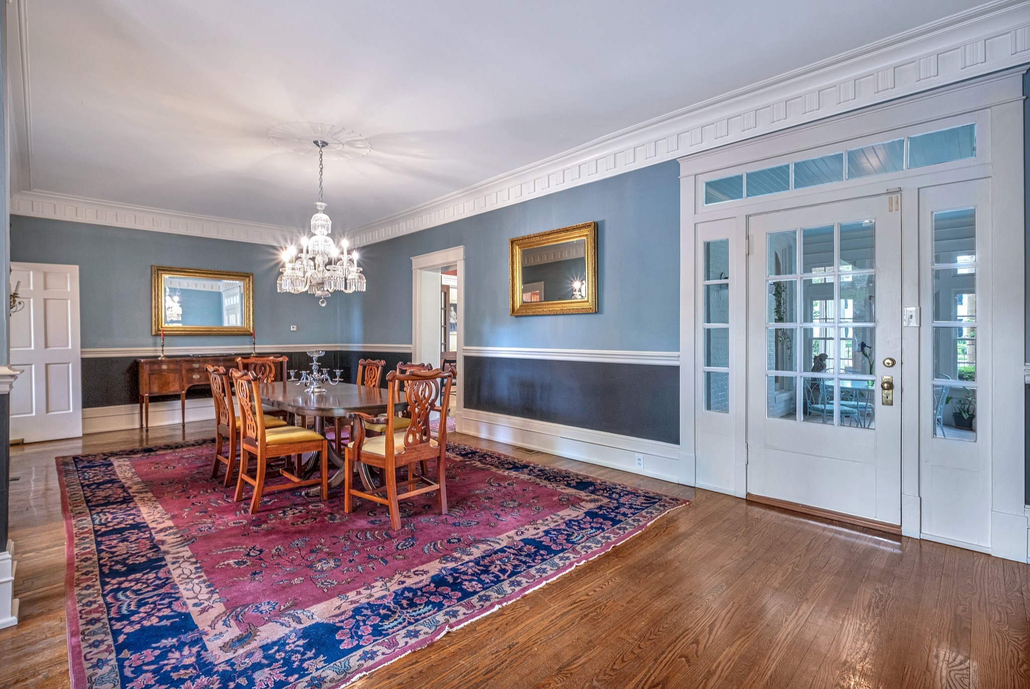 908 West Main Street Franklin, TN 37064 - Photo 25 of 55 a view of a dining room with furniture a chandelier and wooden floor