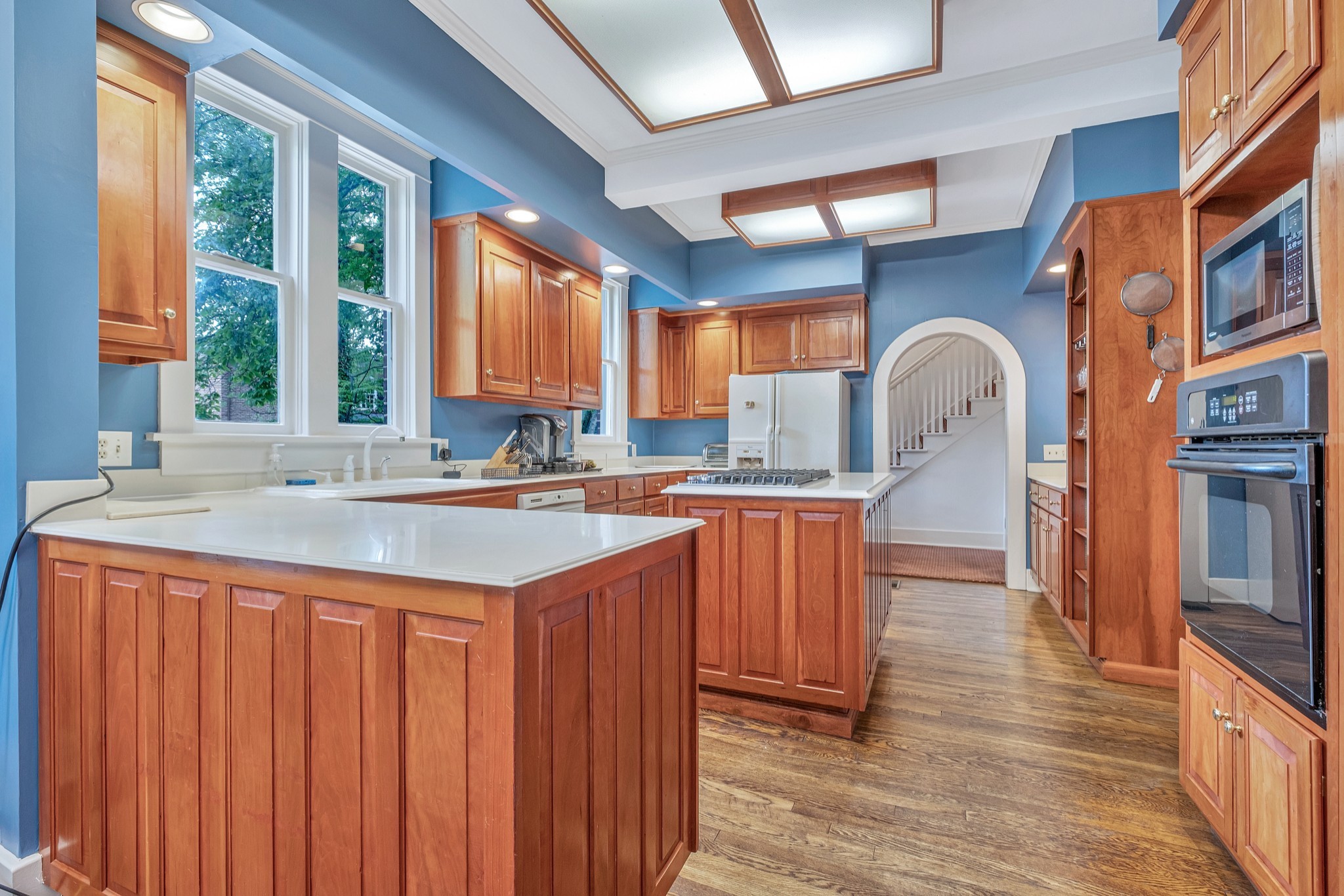 908 West Main Street Franklin, TN 37064 - Photo 26 of 55 a kitchen with stainless steel appliances granite countertop a sink a counter space and a window