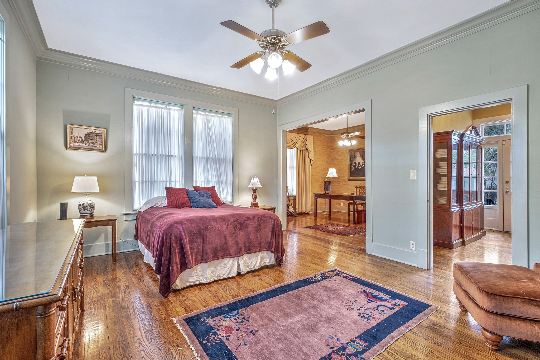 908 West Main Street Franklin, TN 37064 - Photo 32 of 55 a spacious bedroom with a bed a couch and large windows