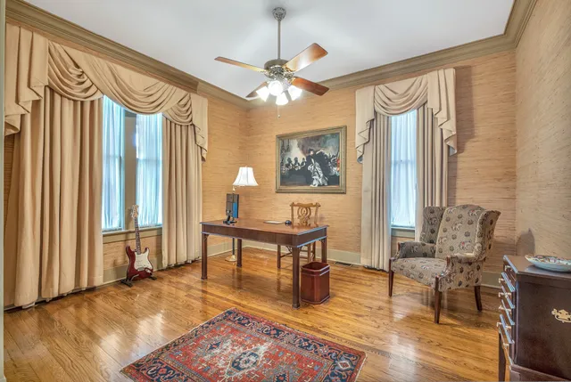 a bedroom with a bed chair and window