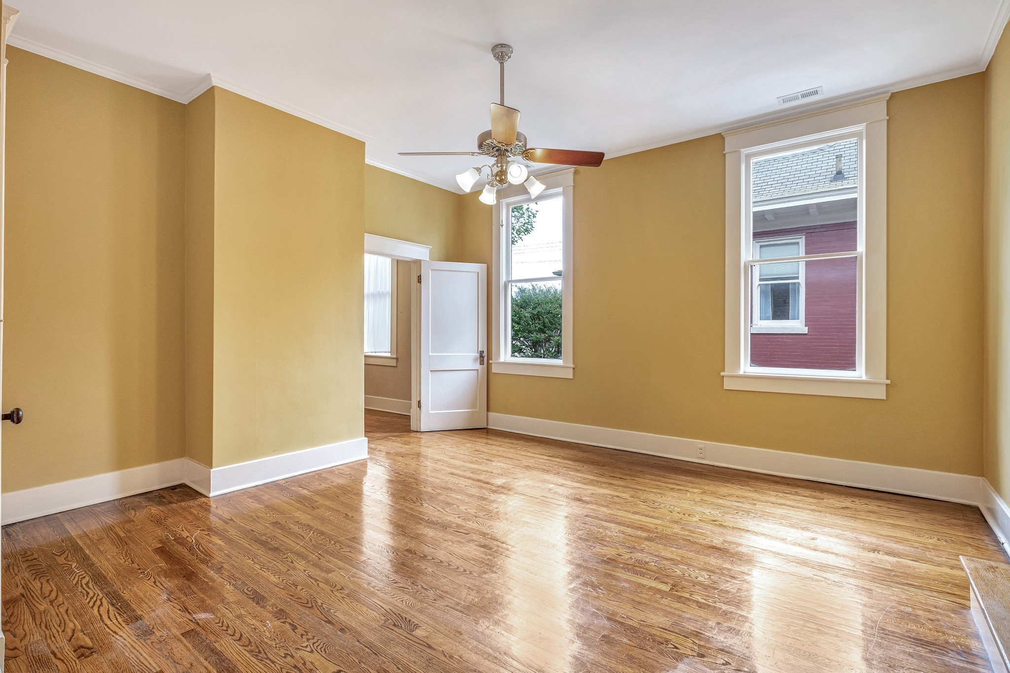 908 West Main Street Franklin, TN 37064 - Photo 43 of 55 a view of an empty room with window and wooden floor