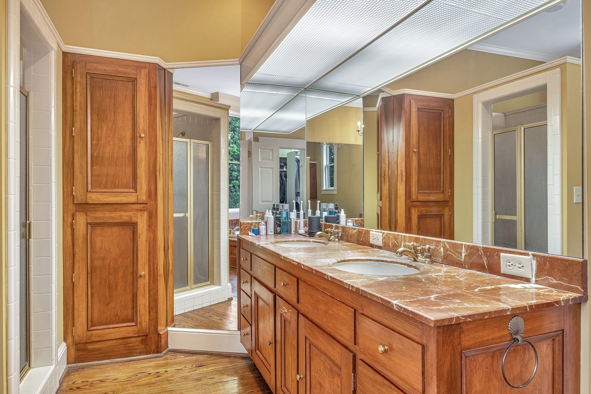 908 West Main Street Franklin, TN 37064 - Photo 46 of 55 a bathroom with a granite countertop sink and a mirror