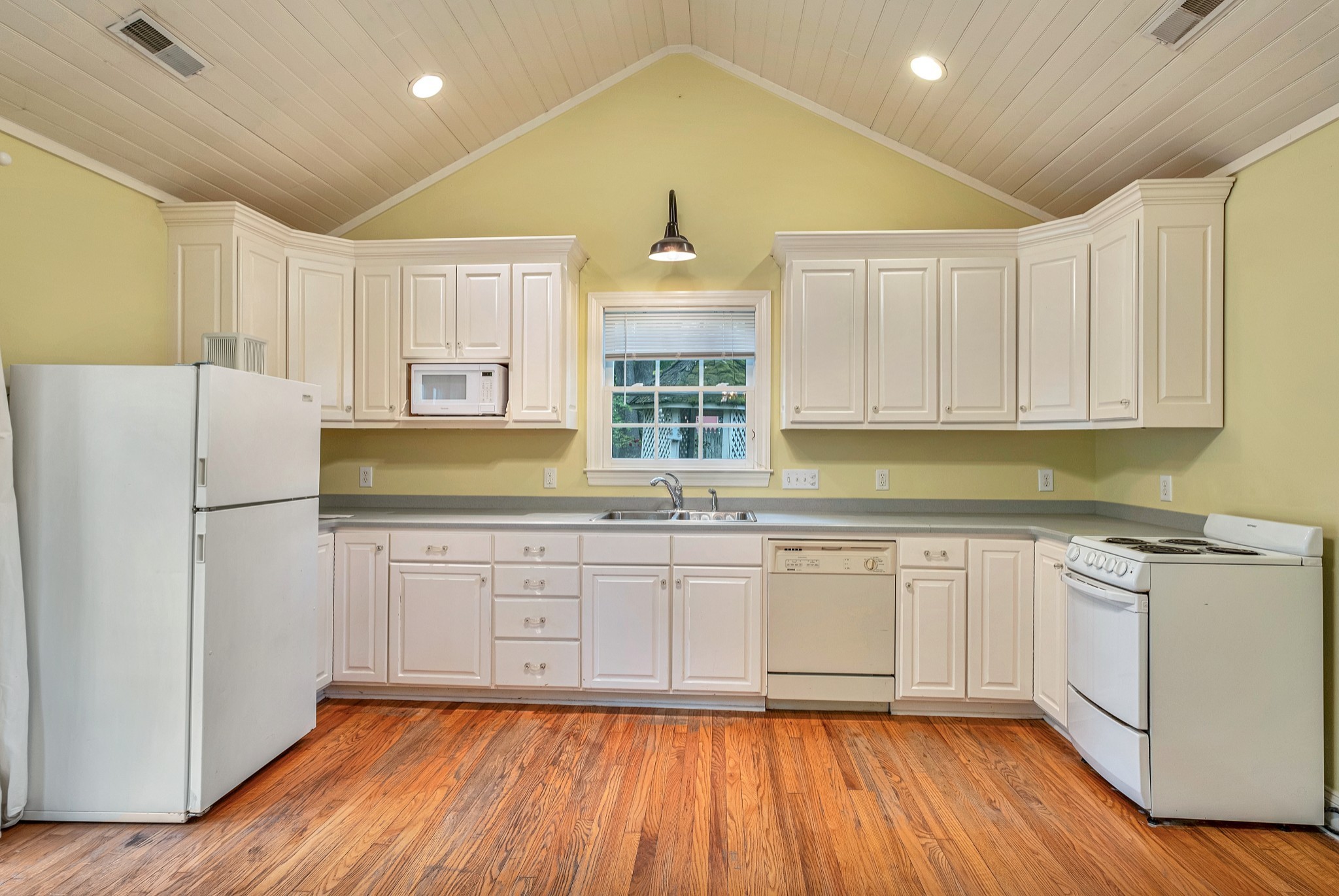 908 West Main Street Franklin, TN 37064 - Photo 50 of 55 a kitchen with granite countertop white cabinets and white appliances