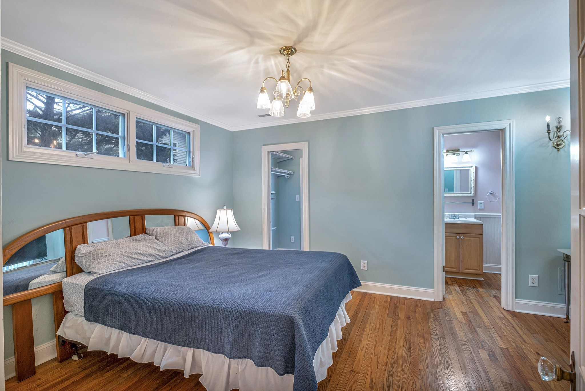 908 West Main Street Franklin, TN 37064 - Photo 51 of 55 a bedroom with a bed and a chandelier