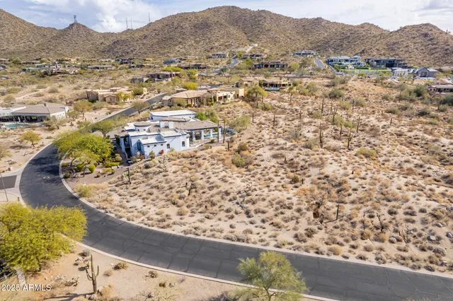 a view of a city with mountains in the background