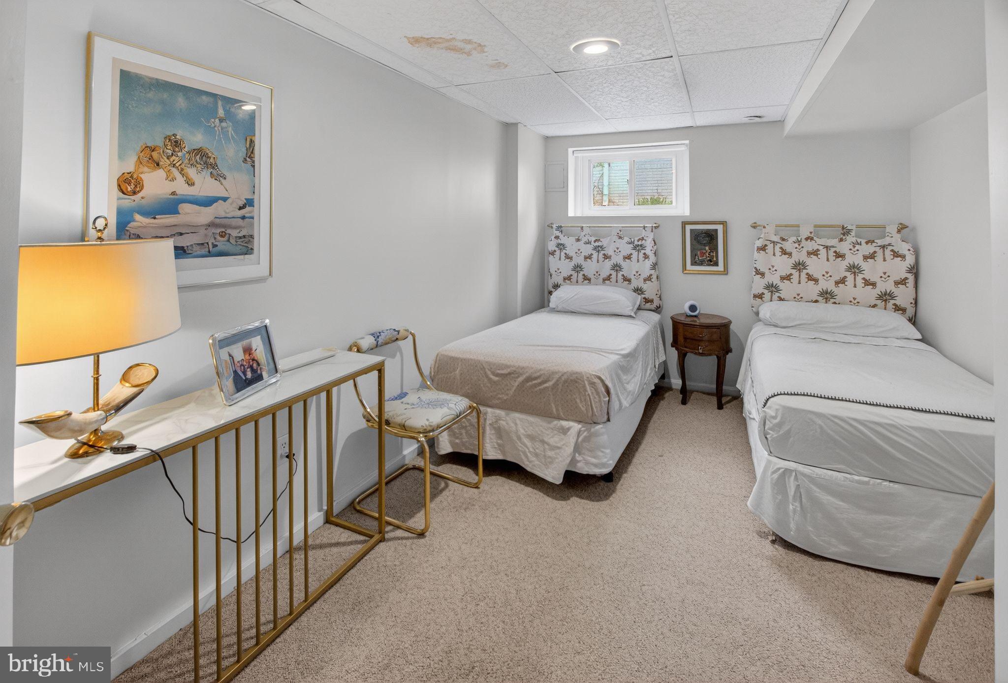5804 Plainview Road Bethesda, MD 20817 - Photo 27 of 34 a spacious bedroom with a bed and a window