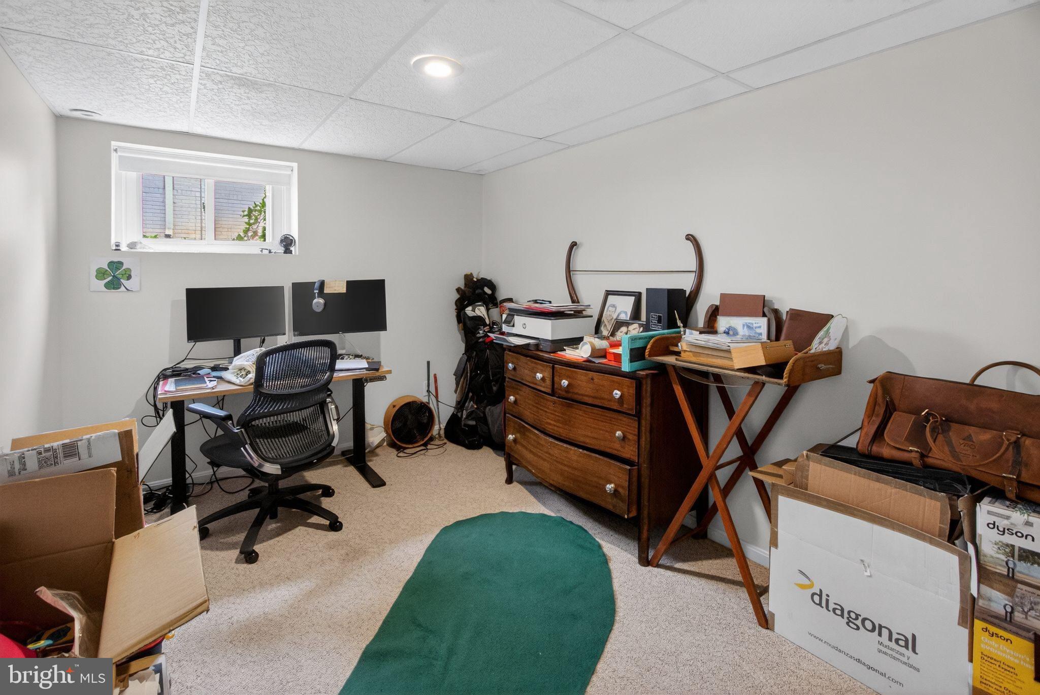 5804 Plainview Road Bethesda, MD 20817 - Photo 28 of 34 a view of a workspace with furniture and a window