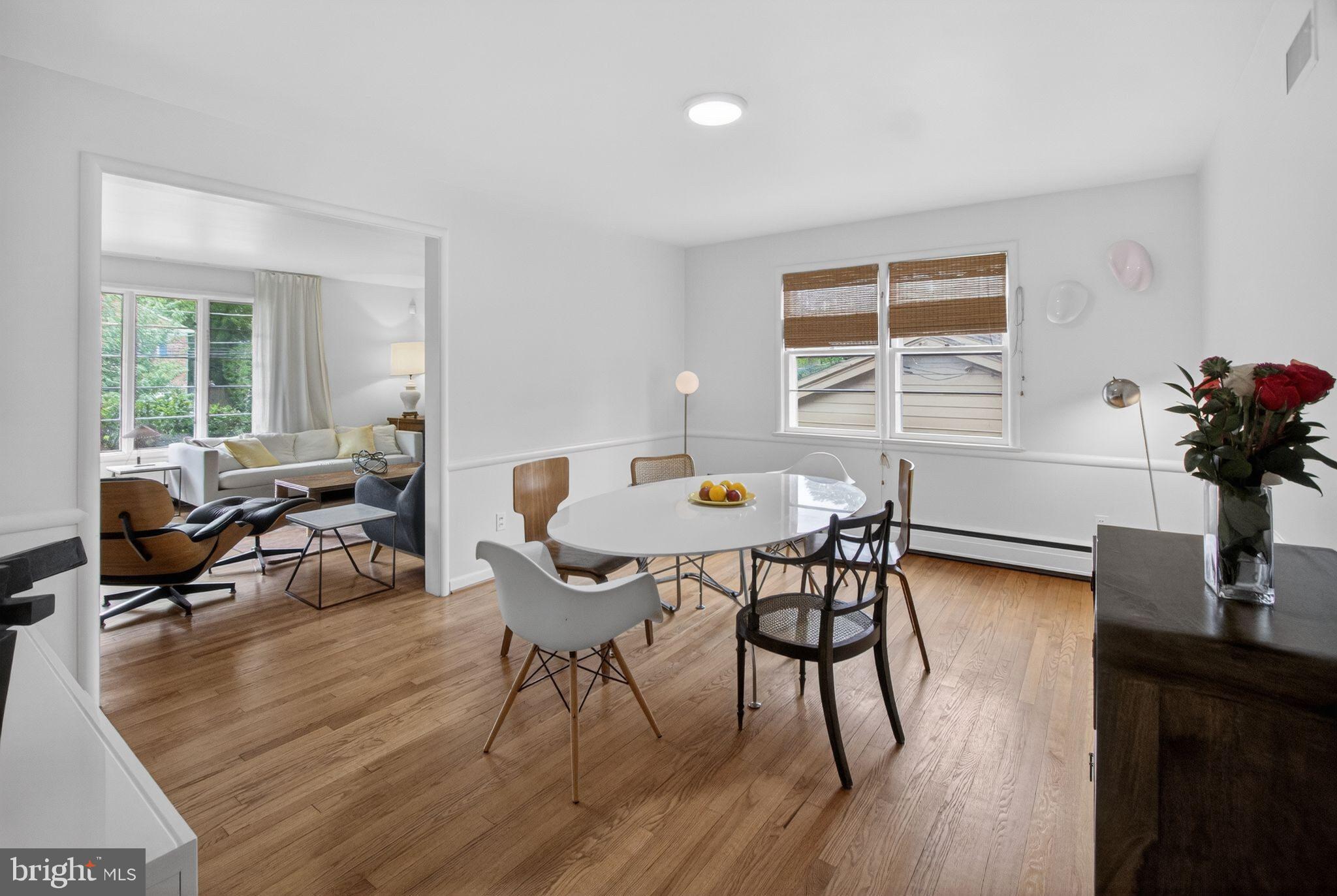 5804 Plainview Road Bethesda, MD 20817 - Photo 7 of 34 a view of a dining room with furniture window and wooden floor