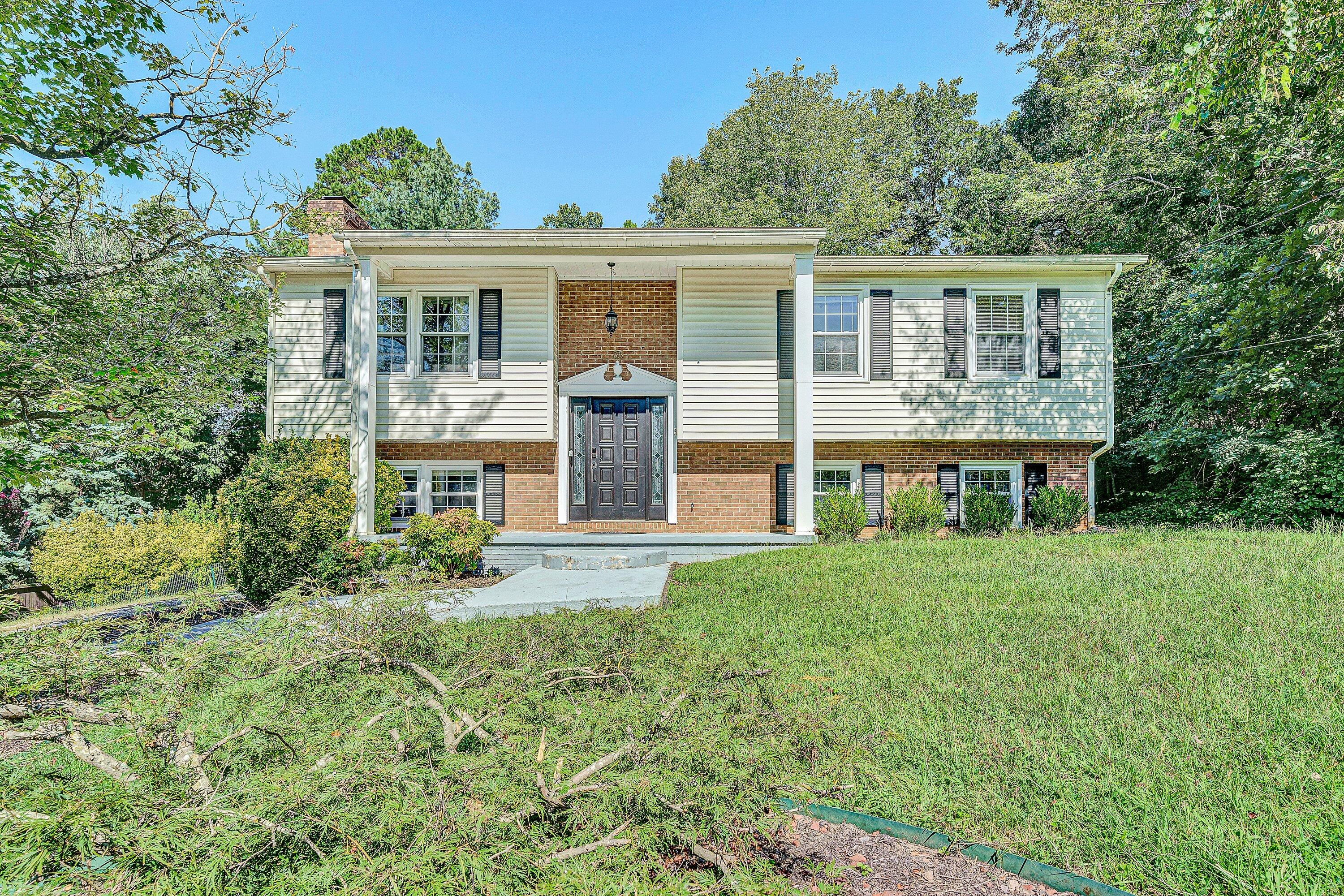 front view of a house with a yard