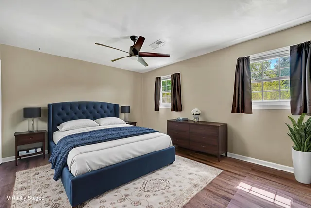 a bedroom with a large bed and a window