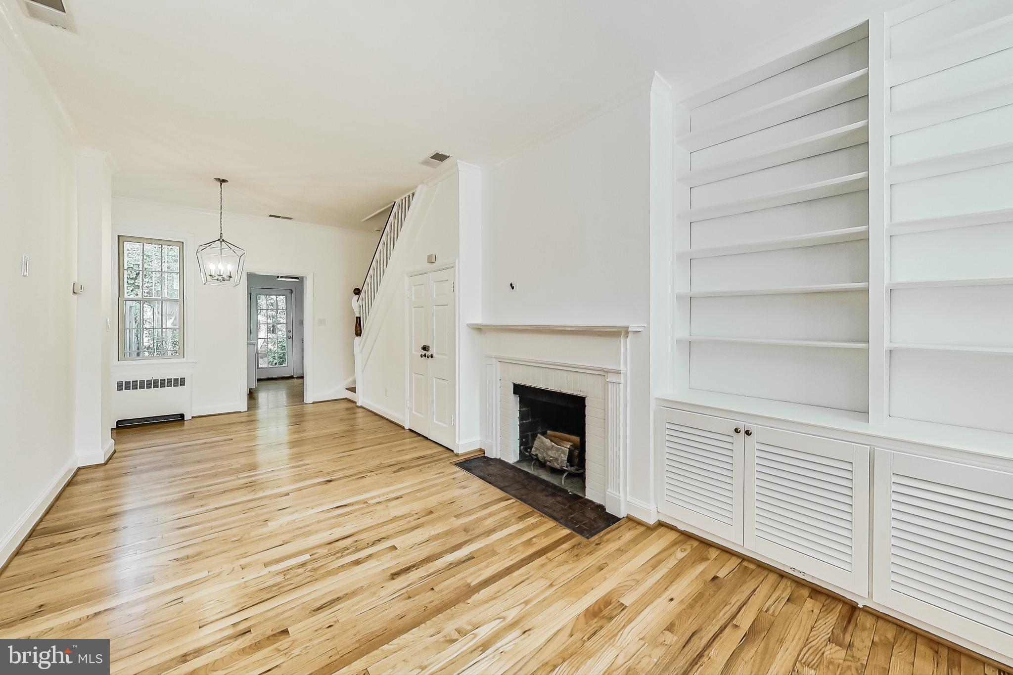 1343 28th Street Northwest Washington, DC 20007 - Photo 7 of 21 Wood burning fireplace and built-in shelves