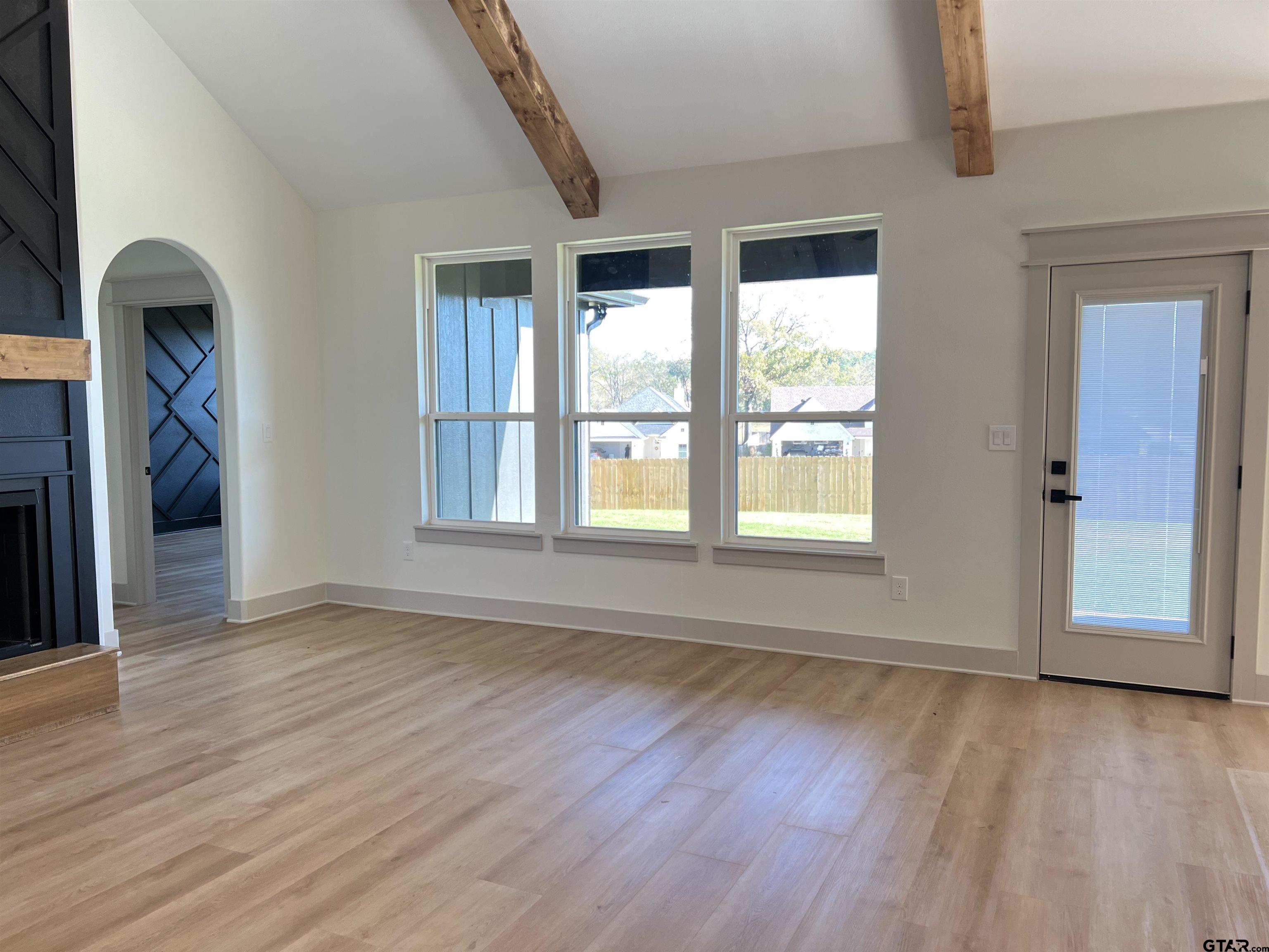 242 Sides Bullard, TX 75757 - Photo 14 of 41 an empty room with wooden floor and windows