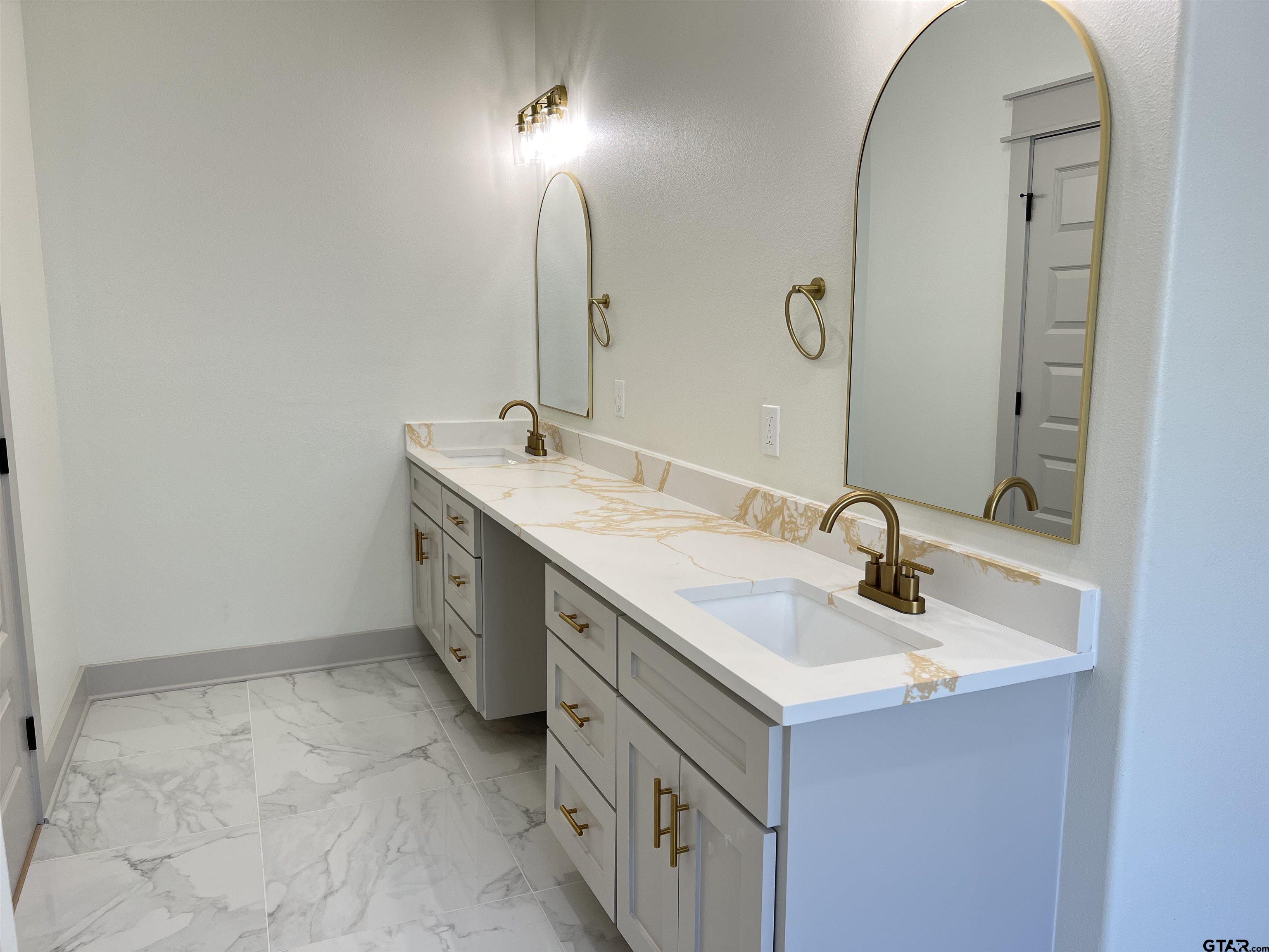 242 Sides Bullard, TX 75757 - Photo 21 of 41 a bathroom with a sink and a mirror