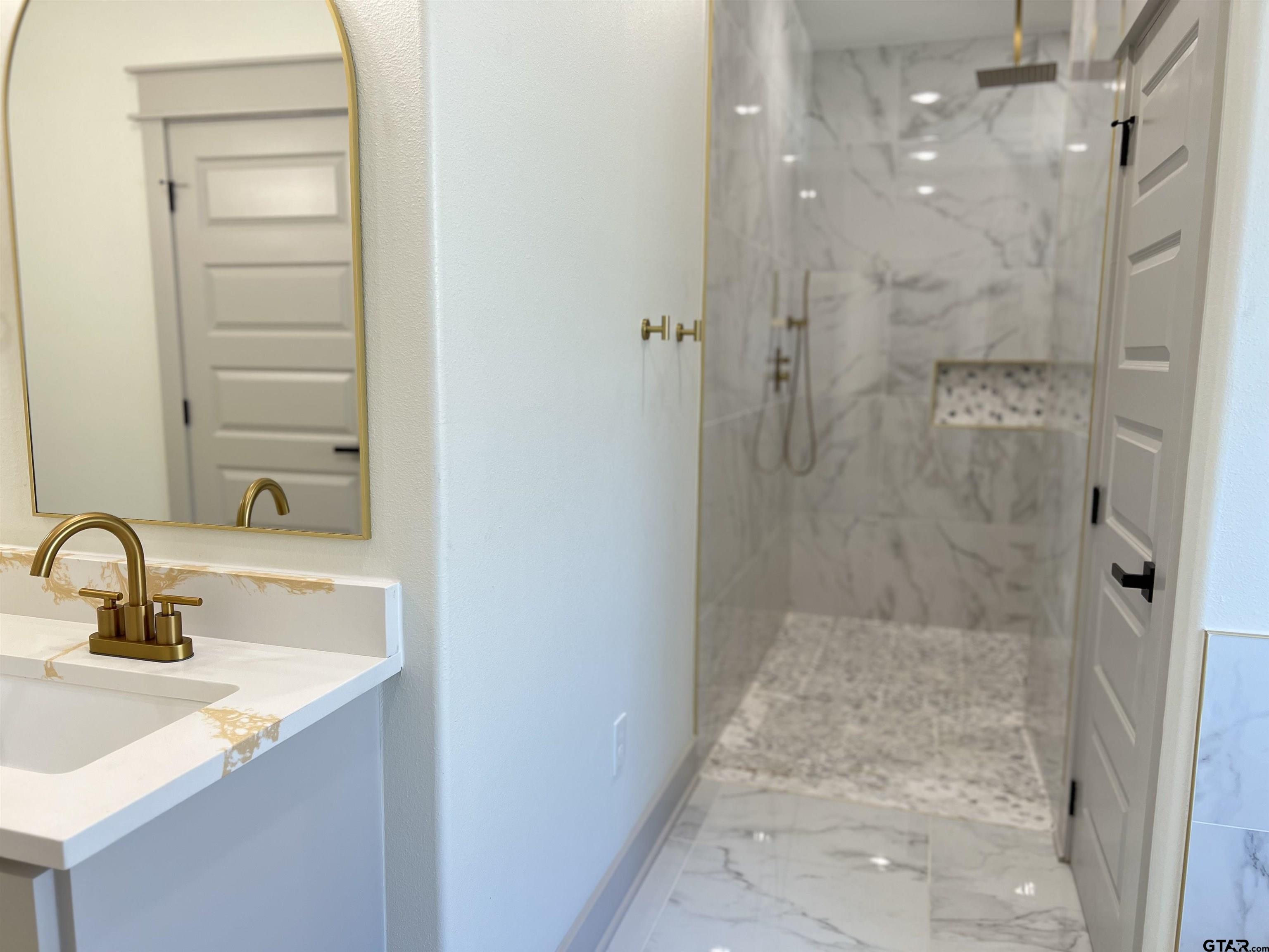 242 Sides Bullard, TX 75757 - Photo 23 of 41 a bathroom with a sink shower and a mirror