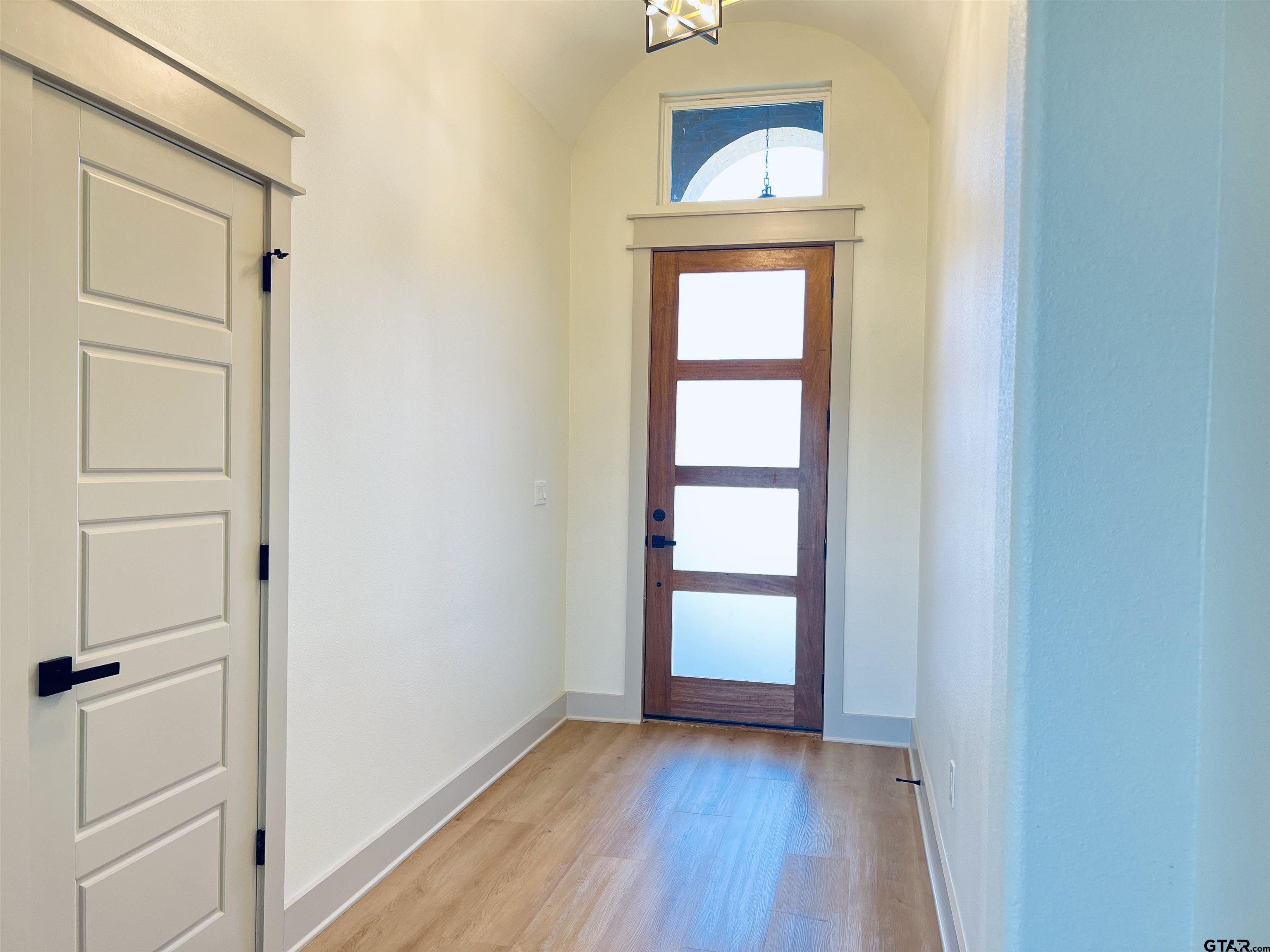 242 Sides Bullard, TX 75757 - Photo 9 of 41 an empty room with wooden floor closet and windows