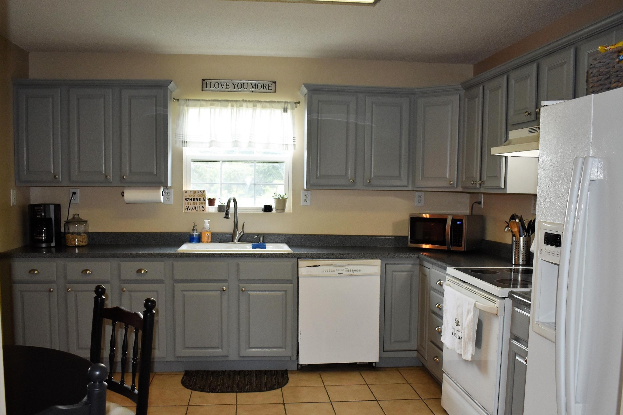 5124 Morganton Road Greenback, TN 37742 - Photo 11 of 23 a kitchen with a sink a stove a refrigerator and cabinets