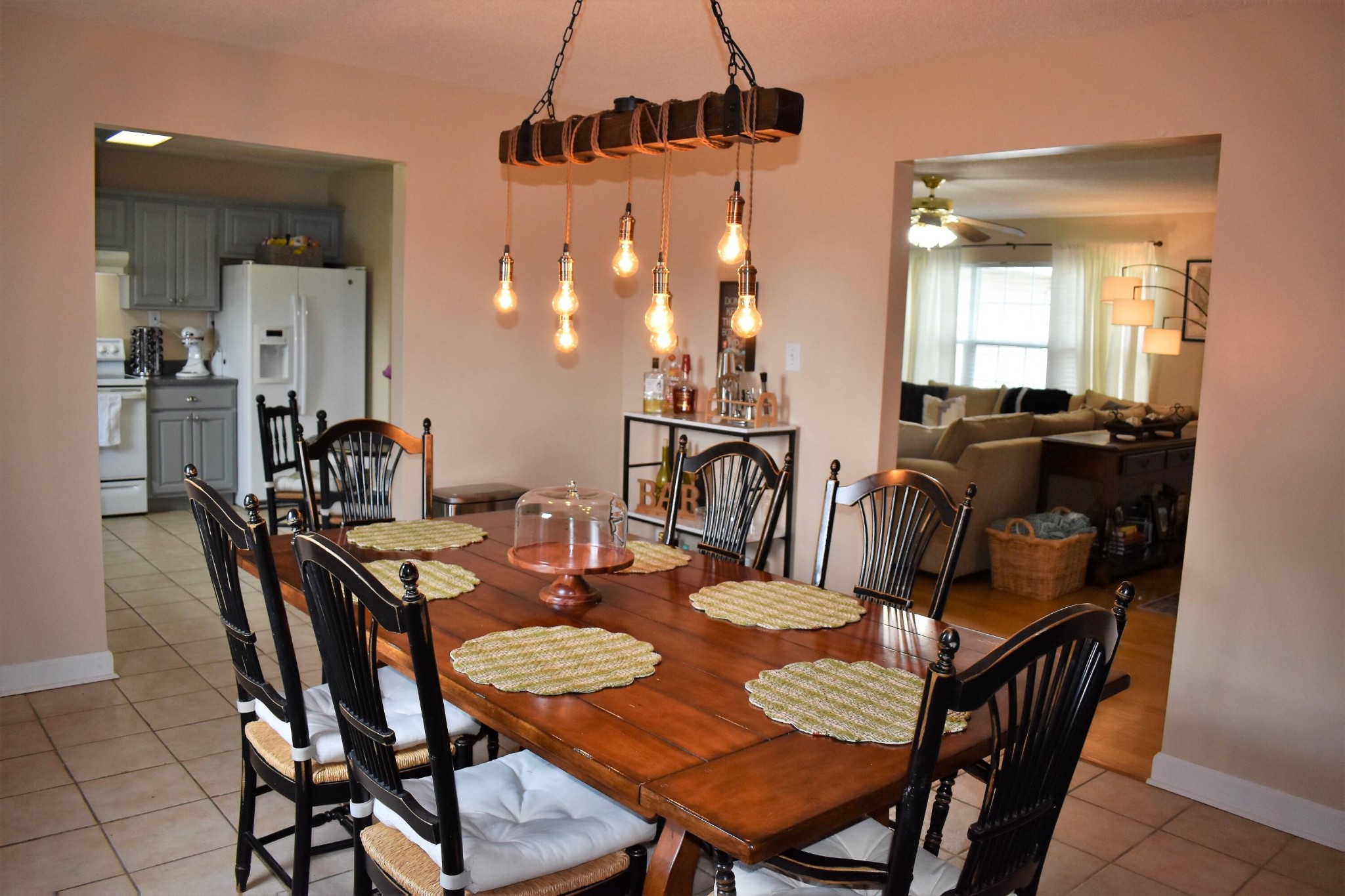 5124 Morganton Road Greenback, TN 37742 - Photo 13 of 23 a view of a dining room and livingroom with furniture wooden floor a chandelier