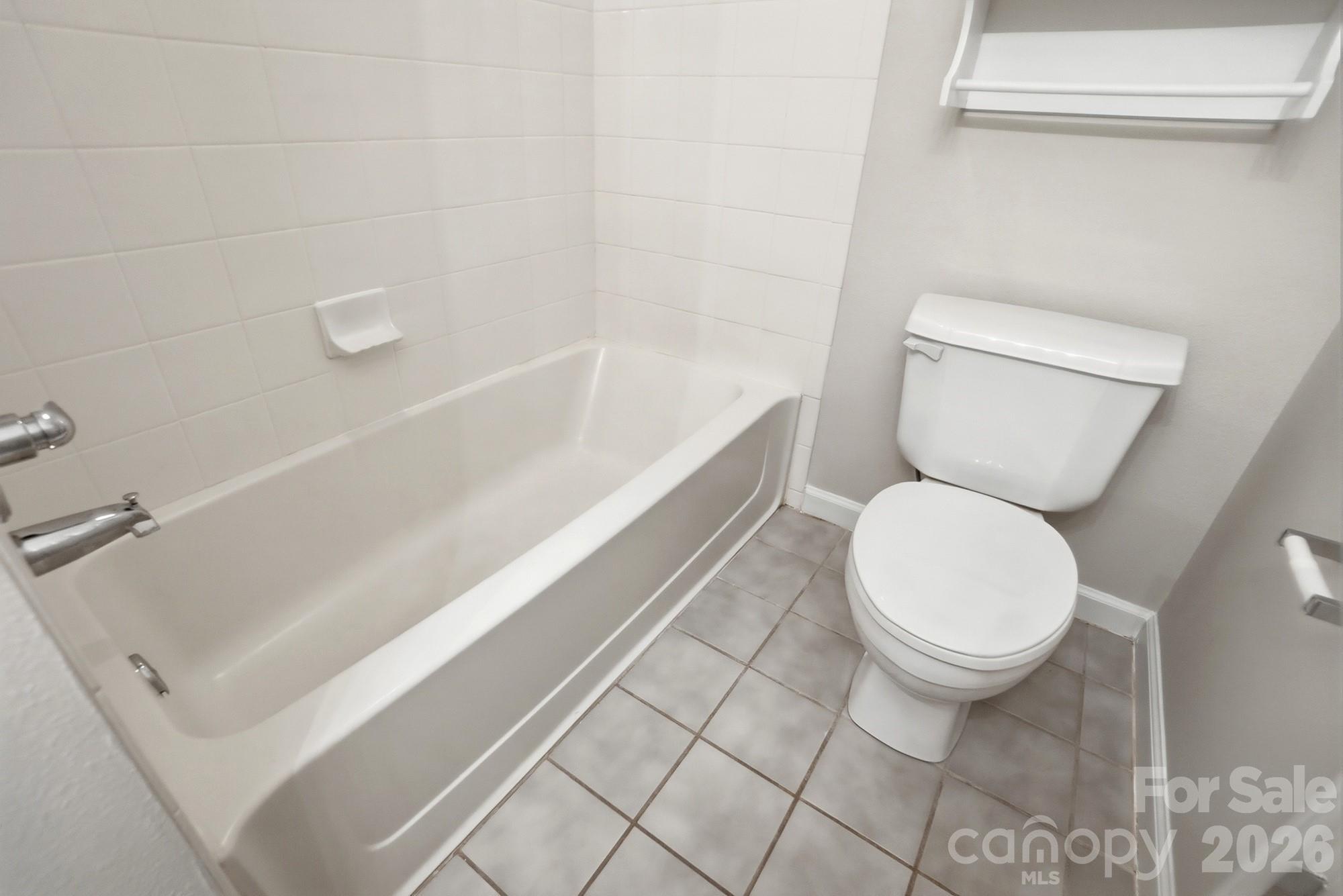 711 Stone Village Drive Fort Mill, SC 29708 - Photo 39 of 46 a bathroom with a toilet and a bathtub