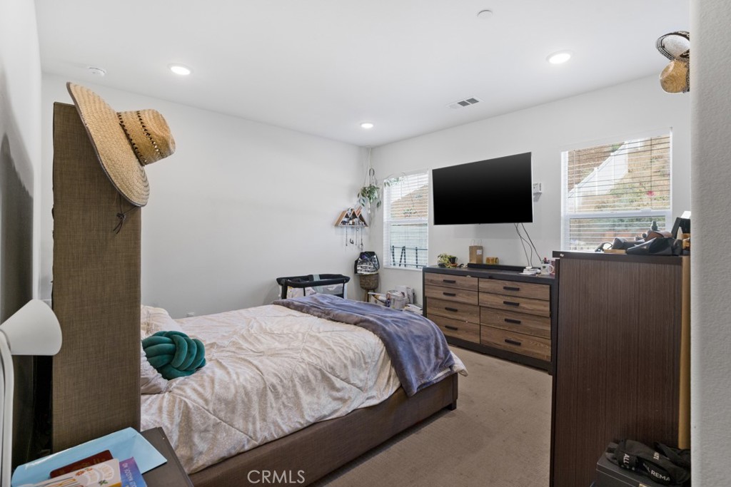 20920 Spring Street Riverside, CA 92507 - Photo 18 of 30 a bedroom with a bed and a flat screen tv