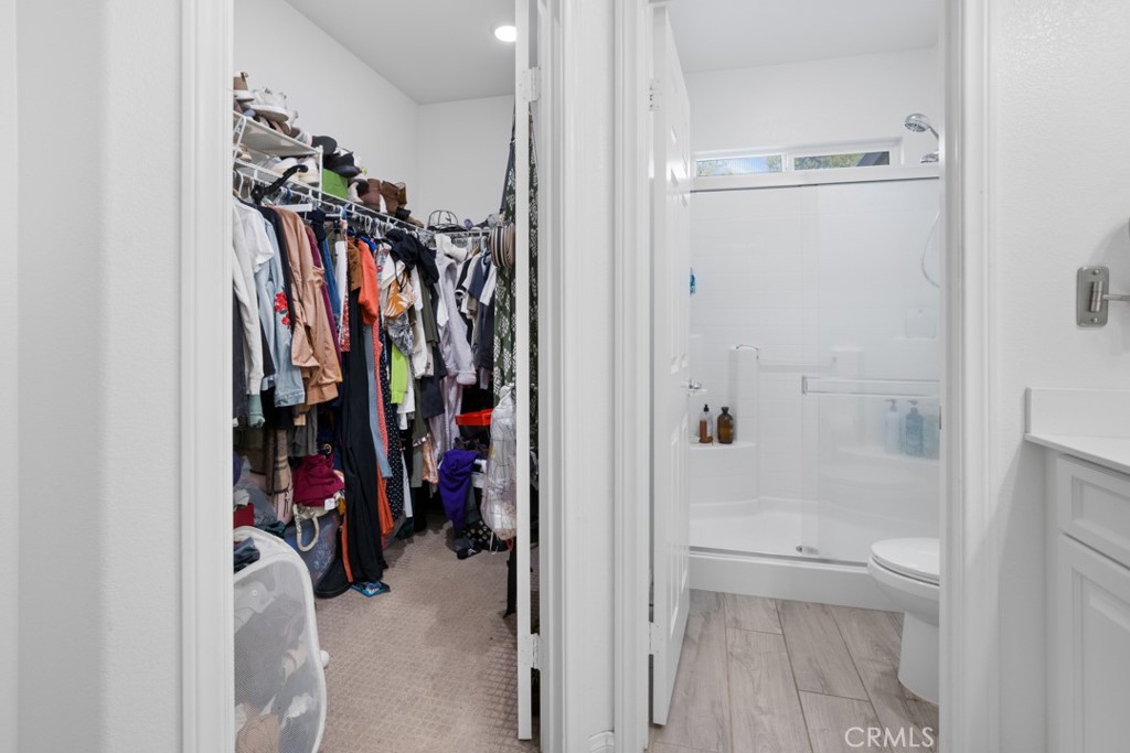 20920 Spring Street Riverside, CA 92507 - Photo 21 of 30 a view of walk in closet with clothes
